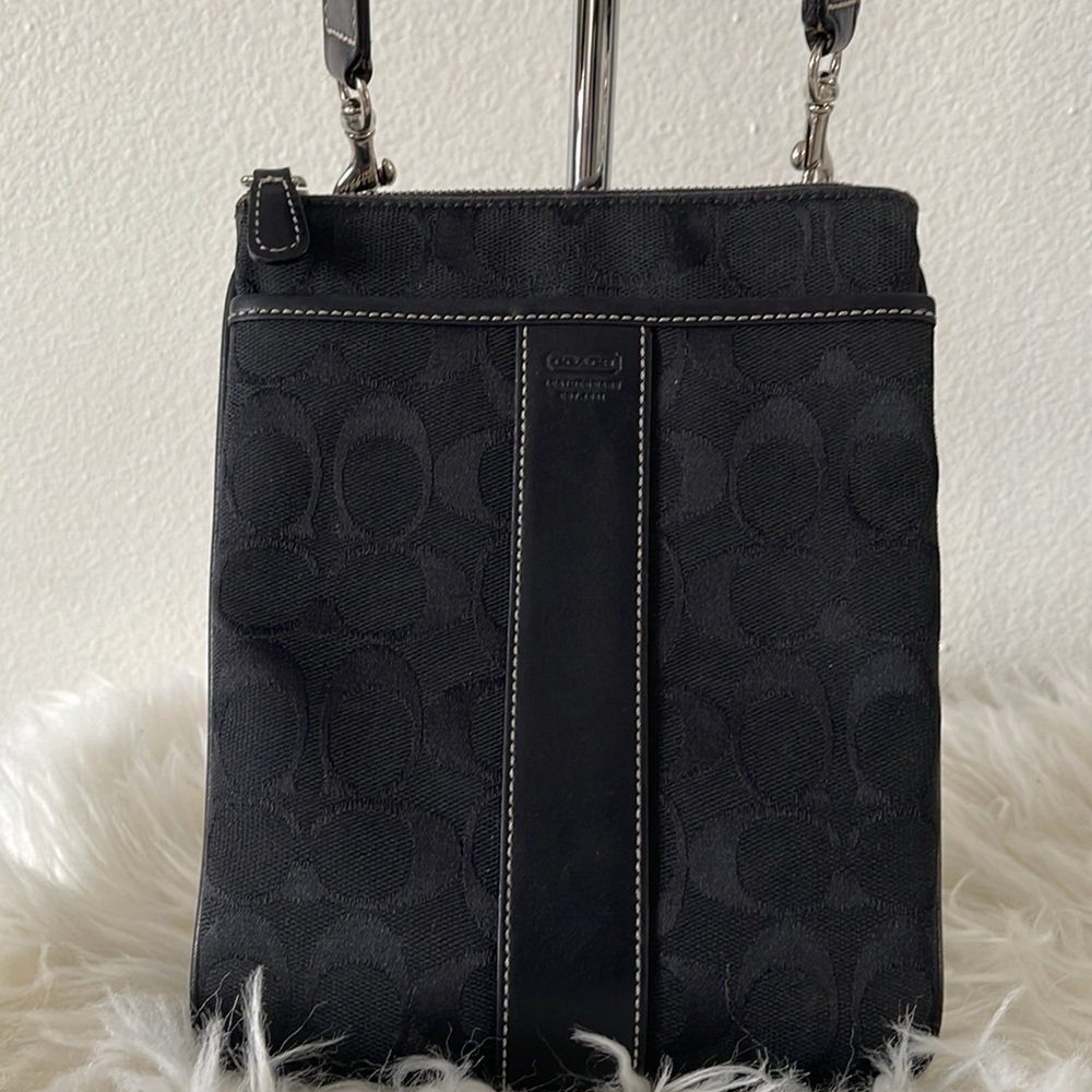 Black Coach crossbody logo purse. Size 7”W x 9”L. Canvas and leather. EUC.